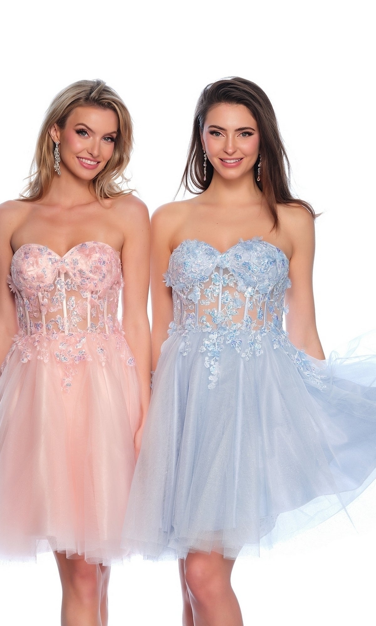 Two women stand side by side in strapless, knee-length dresses: one wears the Sheer Glitter Homecoming Dress 11973 in pink with a sheer corset, while the other dazzles in a light blue, floral embroidered homecoming dress.